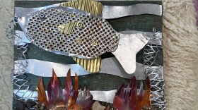 A sculpture picture featuring metal pieces to look like a scene from underwater.