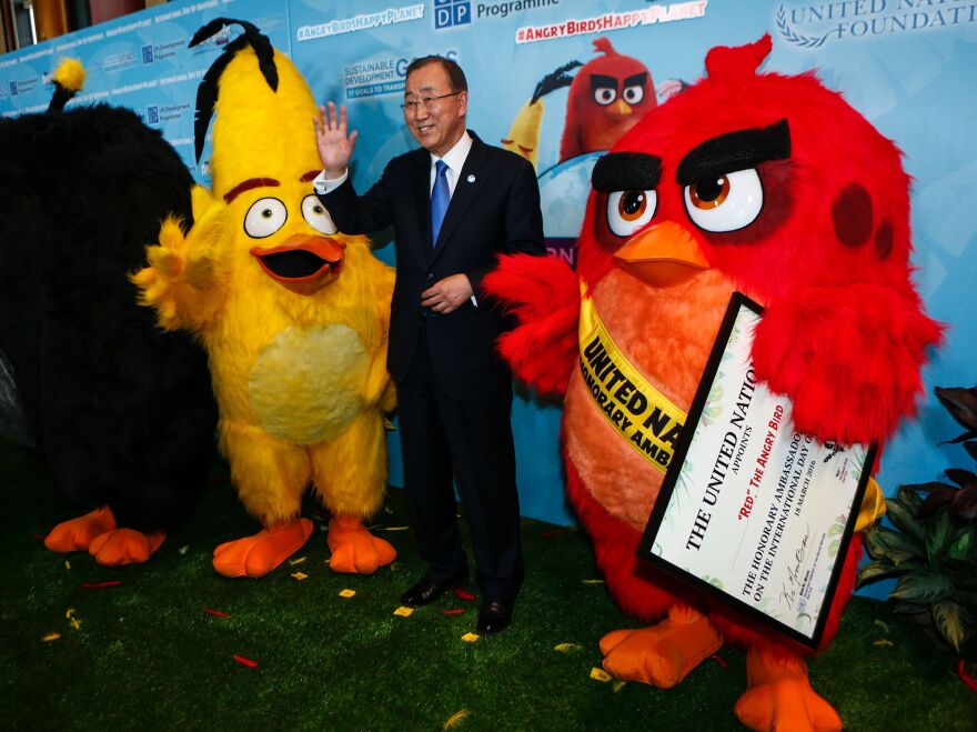 U.N. Secretary-General Ban Ki-moon poses after naming "Red the Angry Bird" as an honorary ambassador to the United Nations on March 18.