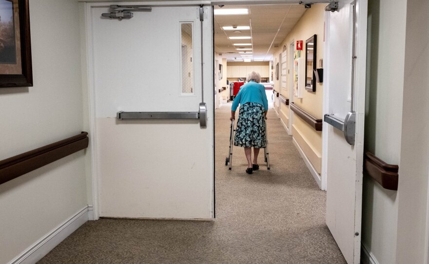 Betty Shaver returns to her room after a visit with her family.