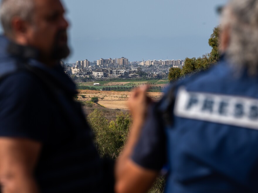 Members of the press wait on an overlook in Sderot, Israel, to report on the fighting in Gaza on Oct. 21.