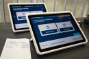A tablet sits ready for voters at Louisville's first drive-through voting center, opening during the 2026 General Election, located at the Kentucky Expo Center.