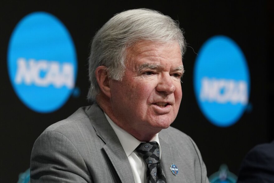 NCAA President Mark Emmert speaks at a news conference at the Target Center, site of of the Women's Final Four NCAA college basketball tournament, March 30, 2022, in Minneapolis. Emmert is stepping down after 12 years on the job. NCAA Board of Governors Chairman John DeGioia announced the move Tuesday, April 26, and said it was by mutual agreement. Emmert will continue to serve in his role until a new president is selected and in place or until June 30, 2023.