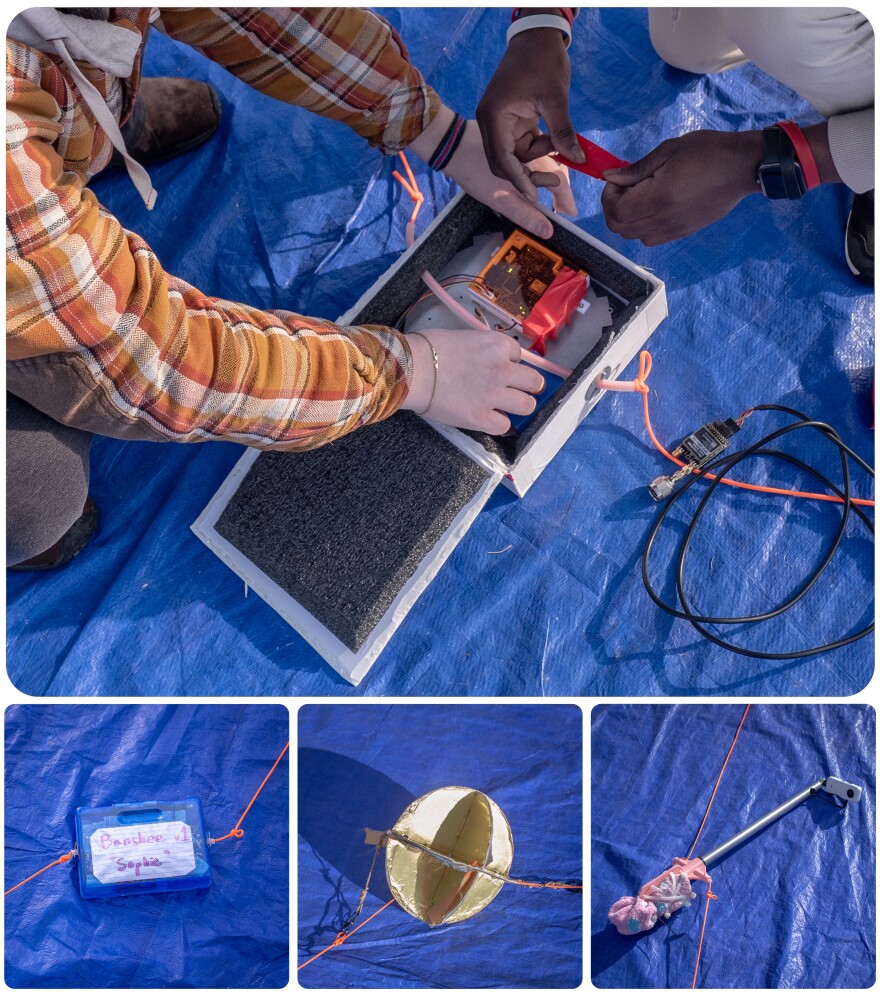 Students ready their payloads ahead of the flight. The equipment includes cameras, tracking devices, and sensors to monitor conditions high above the Earth.