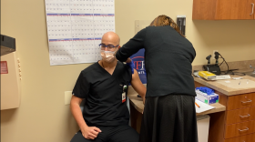 Pharmacist Erika Jasper administers the Pfizer/BioNTech vaccine to Dr. Elias Maroun. Photo: Joe Byrnes