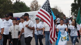 Dodge City protesters gather at Wright Park on Sept. 25, 2026, to march to U.S. Rep. Tracey Mann’s office. They were protesting U.S. Immigration and Customs Enforcement actions in the community.