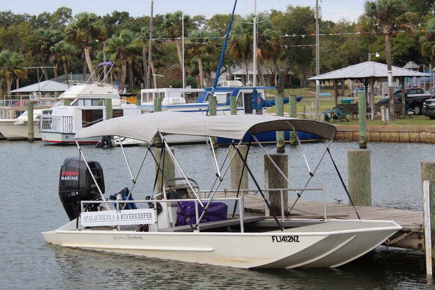 Boats rest on a dock in the Apalachicola Bay