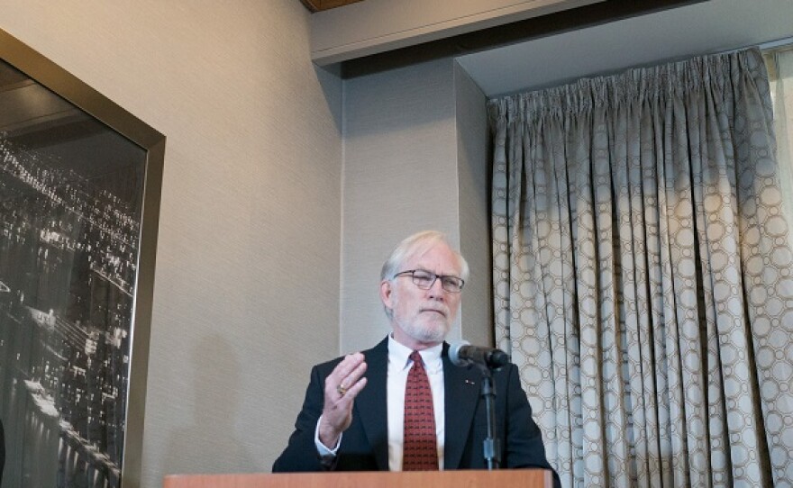 photo of David Crane speaking at a podium