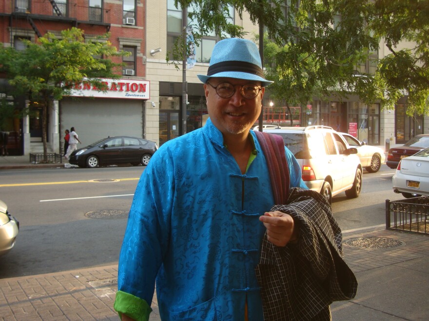 Fred Ho is known for the bright clothing he wears, which he makes himself.