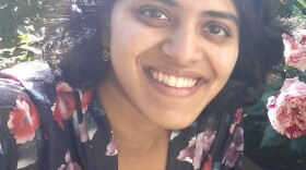 Aishwarya Krishnamoorthy is looking at the camera and smiling.