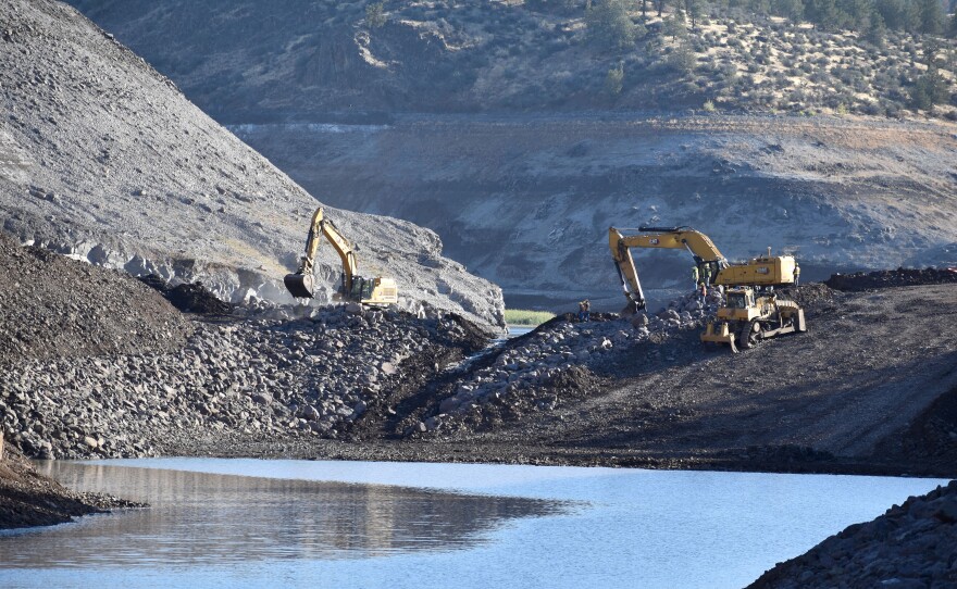 A temporary cofferdam being breached at the site of Iron Gate dam on Aug. 28, 2024.