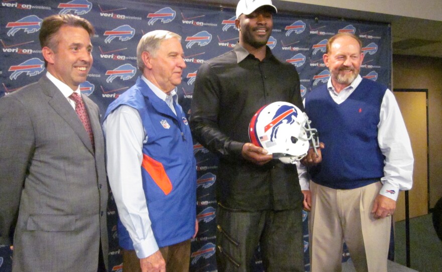 CEO Russ Brandon, GM Buddy Nix, DE Mario Williams, and head coach Chan Gailey