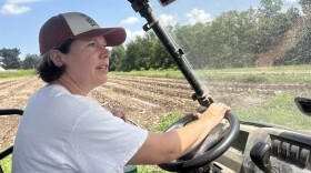 Liz Krug drives a cart around her farm, Endless Roots Farm, on July 30, 2025 in Waverly, PA.