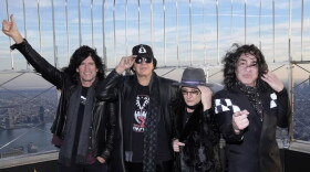Kiss band members, from left, Tommy Thayer, Gene Simmons, Eric Singer and Paul Stanley participate in the ceremonial lighting of the Empire State Building on Thursday in New York.