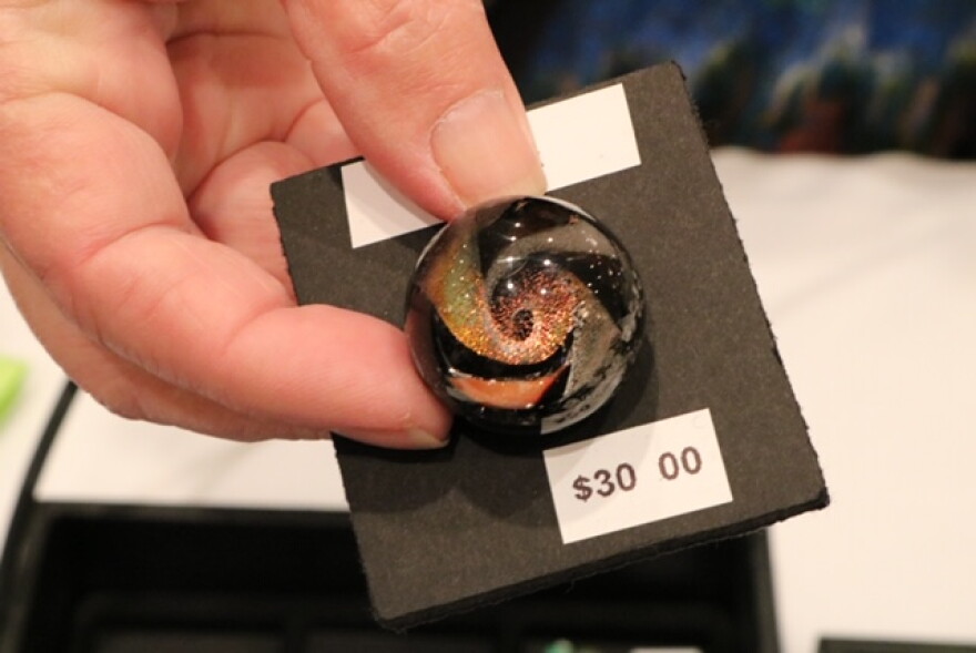 The "modern" button, lampwork artist Delilah Davis creates 3-D buttons inspired by glass marbles.