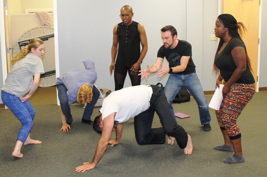 Actors play the part of other ghosts surrounding the ghost of King Hamlet in this November 3, 2016 photo.