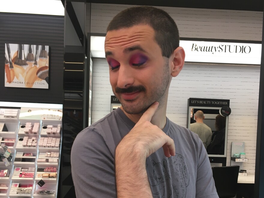 Reporter Darius Rafieyan enjoying his freshly completed makeup look.