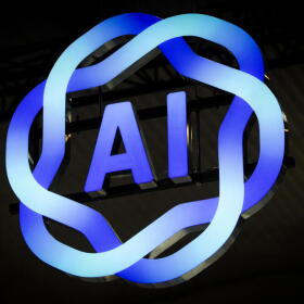 Signage of AI is displayed during the MWC (Mobile World Congress), the world's biggest mobile fair, in Barcelona on March 3, 2025. (Manaure Quintero/AFP via Getty Images)