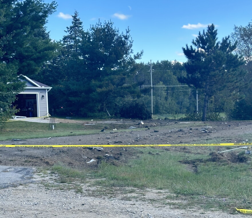 Crash debris scattered near a resident's garage shortly after a F-16 fighter jet from Texas went down Thursday afternoon in Green Lake Township.