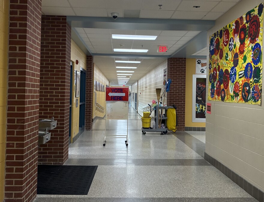 Vote Here sign in the hallway of polling location Diggs-Latham Elementary School.