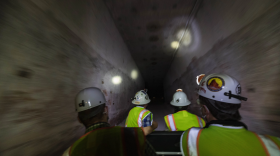 A tour group rides on a cart through a geological repository, U.S. Department of Energy's Waste Isolation Pilot Plant, storing transuranic radioactive waste in the desert between Hobbs and Carlsbad on Tuesday, Aug. 17, 2021.