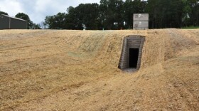 The artificial cave built for bats in Tennessee has a human entrance below and a bat entrance above. In the summer, any fungus left by the bats over the winter will be cleaned up.