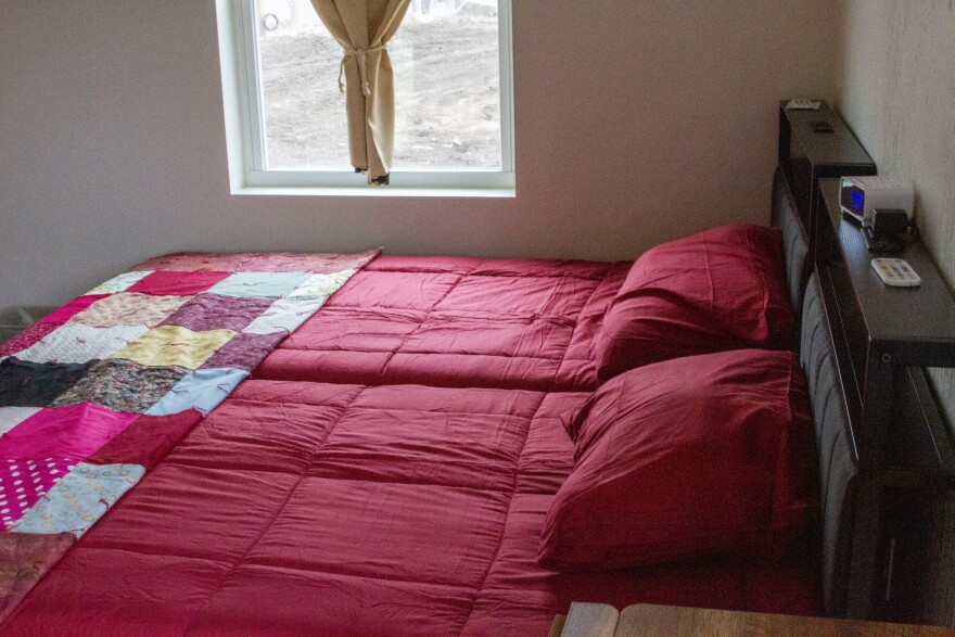 A bed inside of one of the new cabins at The Bridge.