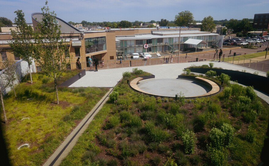 A window in the former boarding house where James Earl Ray shot Dr. Martin Luther King, Jr. shows the new Legacy garden where visitors can overlook the Lorraine Motel courtyard.