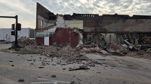 A building in Sedalia partially collapsed, leaving debris on the roadway.
