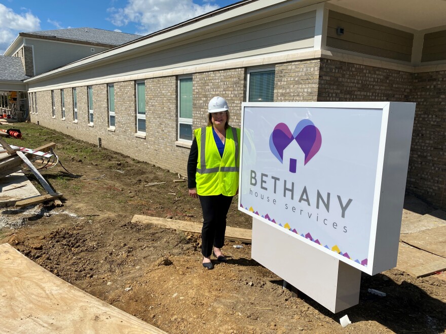 CEO Peg Dierkers stands in front of Bethany House in Bond Hill a few weeks before the scheduled opening October 1, 2022.