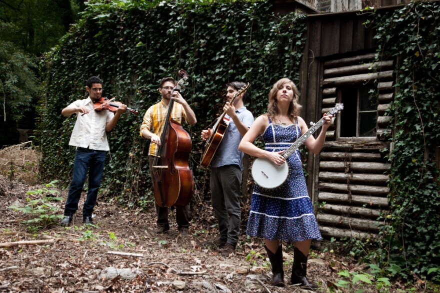 Steph Stewart and The Boyfriends with instruments in hand.