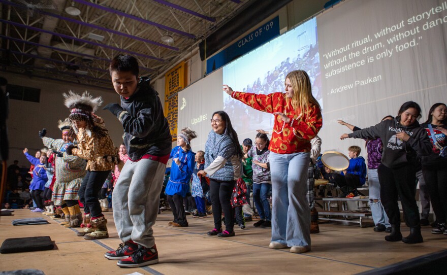 Audience members join Upallret on the Cama'i stage on March 29, 2026 in Bethel, Alaska.