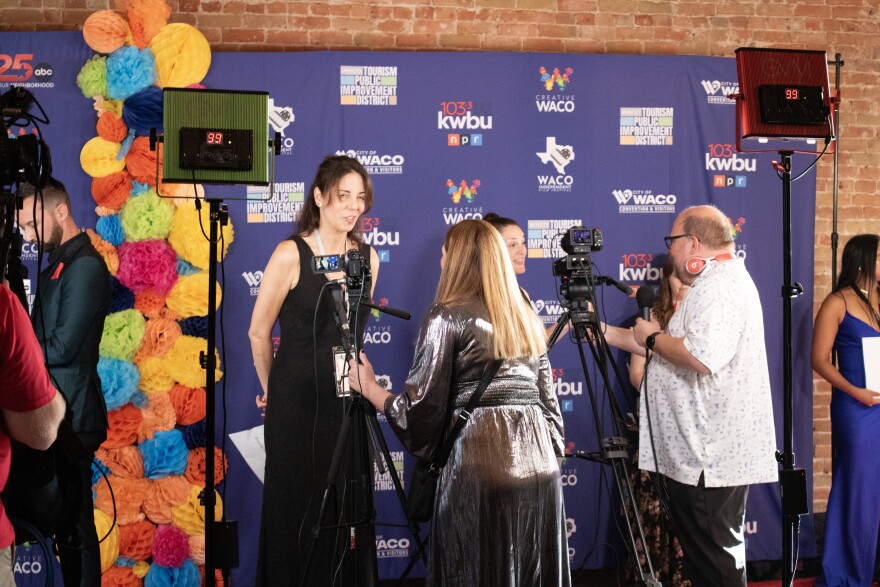Filmmakers walk the red carpet and pause for media interviews during the 2025 Waco Indie Red Carpet on July 17, 2025. 