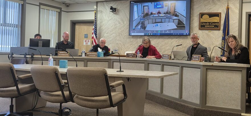 Lincoln County commissioners sit at a table
