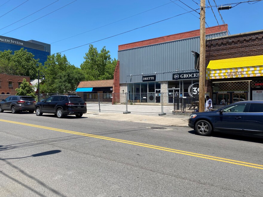 Now fenced off and unoccupied, the section of the building at 39th and Bell streets with a gray facade once housed a movie theater.