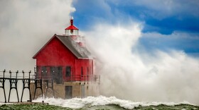 The Grand Haven South Pierhead Inner Light gets a good dose of what Todd and Brad Reed call "magic light" during a November storm in 2015. (credit Brad Reed)