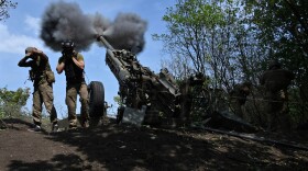 Ukrainian gunmen fire a US made M777 howitzer from their position on the front line in Kharkiv region on Aug. 1, 2022, amid Russia's military invasion launched on Ukraine. (Sergey Bobok/AFP via Getty Images)