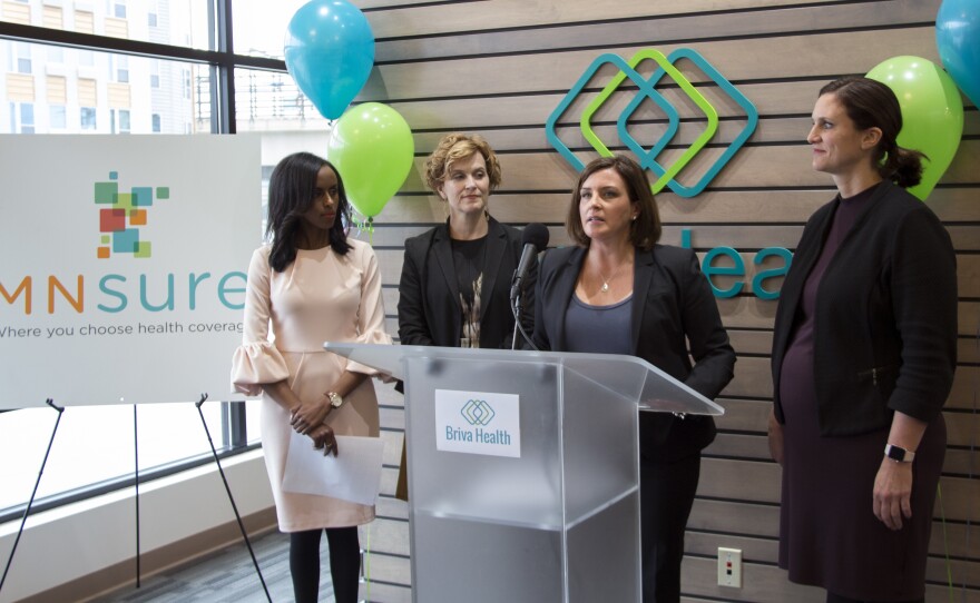 Minnesota's Human Services Commissioner Emily Piper, right, and Minneapolis Mayor Betsy Hodges, second from left, joined MNsure CEO Allison O'Toole, and Hodan Guled, left, at a recent enrollment launch event in Minneapolis.