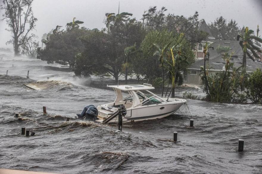  A boat is seen from the Midpoint Bridge in the Caloosahatchee River in Fort Myers as Hurricane Ian hits the West Coast of Florida as Category 4 storm, on Wednesday September 28, 2022