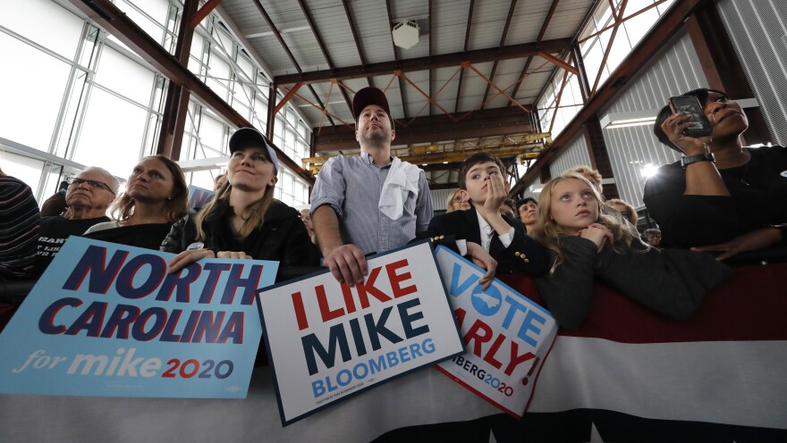 People listen as Mike Bloomberg speaks at a campaign event in Raleigh, N.C., Thursday.