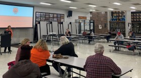 People gather in the Parkside Junior High School cafeteria to hear a Unit 5 presentation on the April 4 tax referendum.