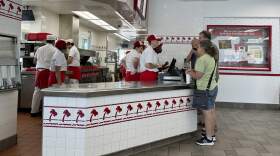 Customers place order at the counter of an In-N-Out burger restaurant Tuesday. (David Zalubowski/AP)