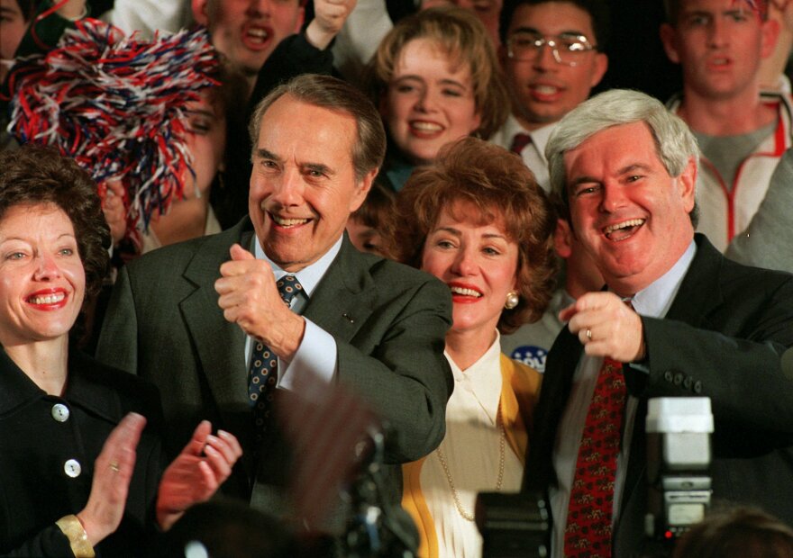 Republican presidential hopeful Sen. Bob Dole, joined by his daughter Robin, left, his wife Elizabeth and then-House Speaker Newt Gingrich of Georgia, right, attends a rally on Tuesday, March 12, 1996 in Washington. 