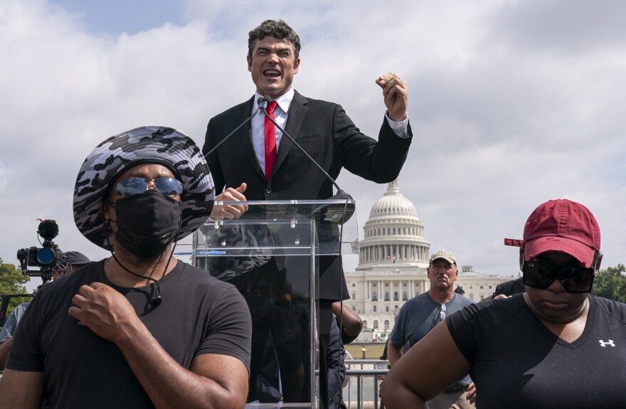 Joe Kent, center, a Trump-endorsed Republican who is challenging Herrera Beutler, speaks during a "Justice For J6" rally near the U.S. Capitol in Washington, on Sept. 18, 2021, in support of people who took part in the Jan. 6 insurrection.