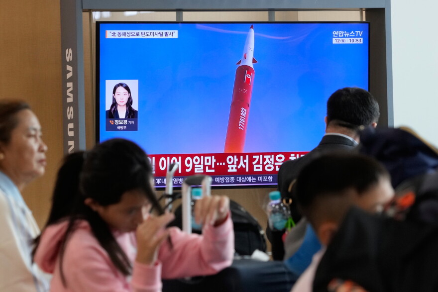A TV screen shows a file image of a North Korean missile launch during a news program at Seoul Railway Station in Seoul, South Korea, Monday, Oct. 12, 2026.