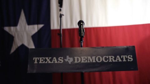 A Texas Democrats sign hangs on a podium at a Democratic watch party following a Texas primary election in Austin.