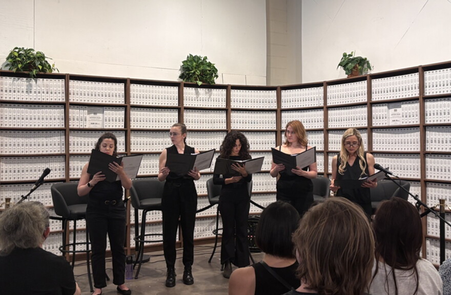 Actors read Sheri Wilner-Deering’s “The Does” in June of 2026 presented at the Donald J. Trump–Jeffrey Epstein Memorial Reading Room in Washington, D.C., a temporary installation of bound volumes of Epstein-related records. A Miami cast will present a staged reading at the Unitarian Universalist Congregation of Miami on Sunday, Oct. 4.