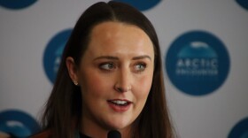 Rachel Kallander, founder and director of the Arctic Encounters symposium, speaks at a press conference at the 2022 Arctic Encounters symposium in Anchorage (Lex Treinen/Alaska Public Media)