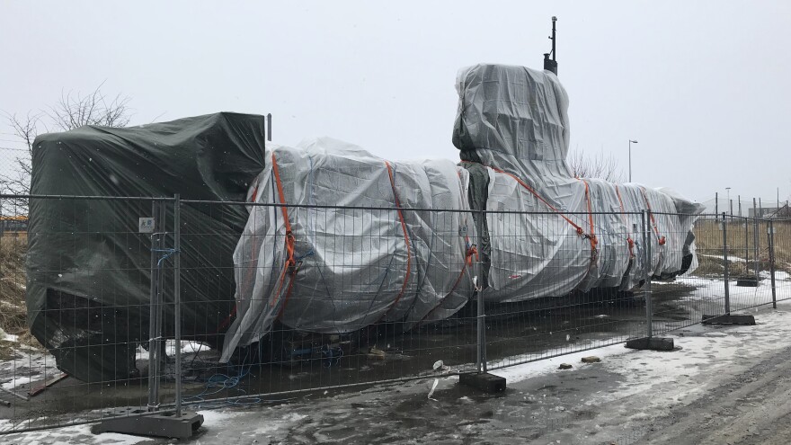 Peter Madsen's submarine, the UC3 Nautilus, stands Wednesday under tarps after police spent months combing the vessel for evidence.