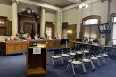 City and county officials seated inside the Monroe County Courthouse
