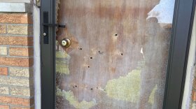 Holes left by bullets in the front door at the home of Indianapolis City-County Councilor Ron Gibson Monday, April 6, 2026.